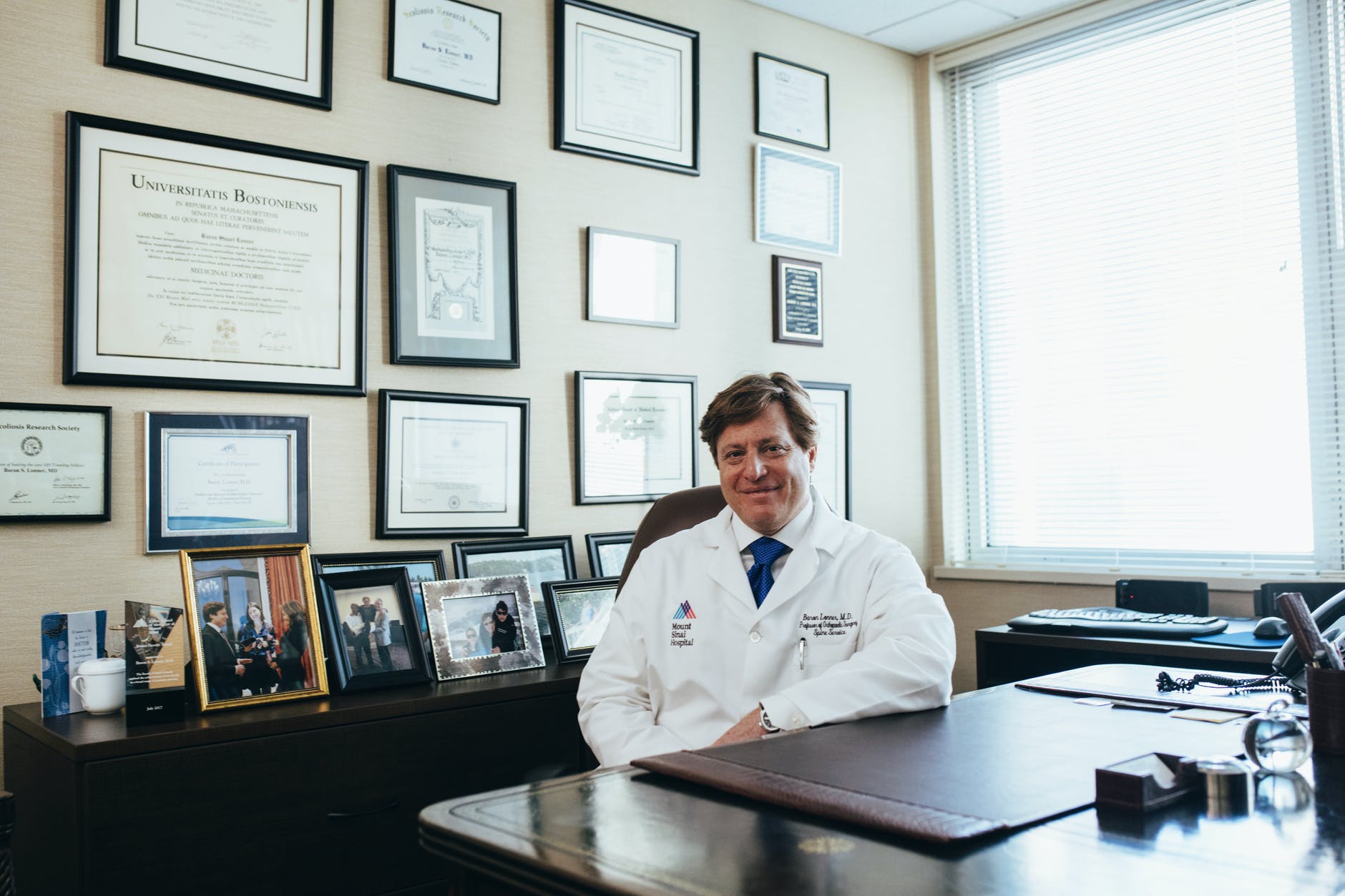 doctor sitting in front of his desk