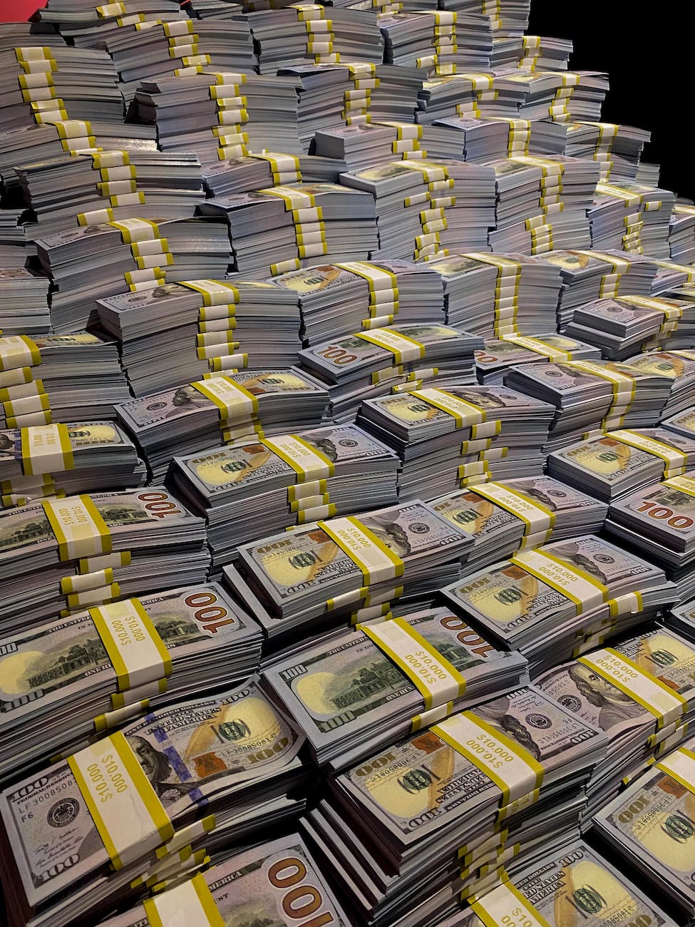 a pile of money stacked on top of each other